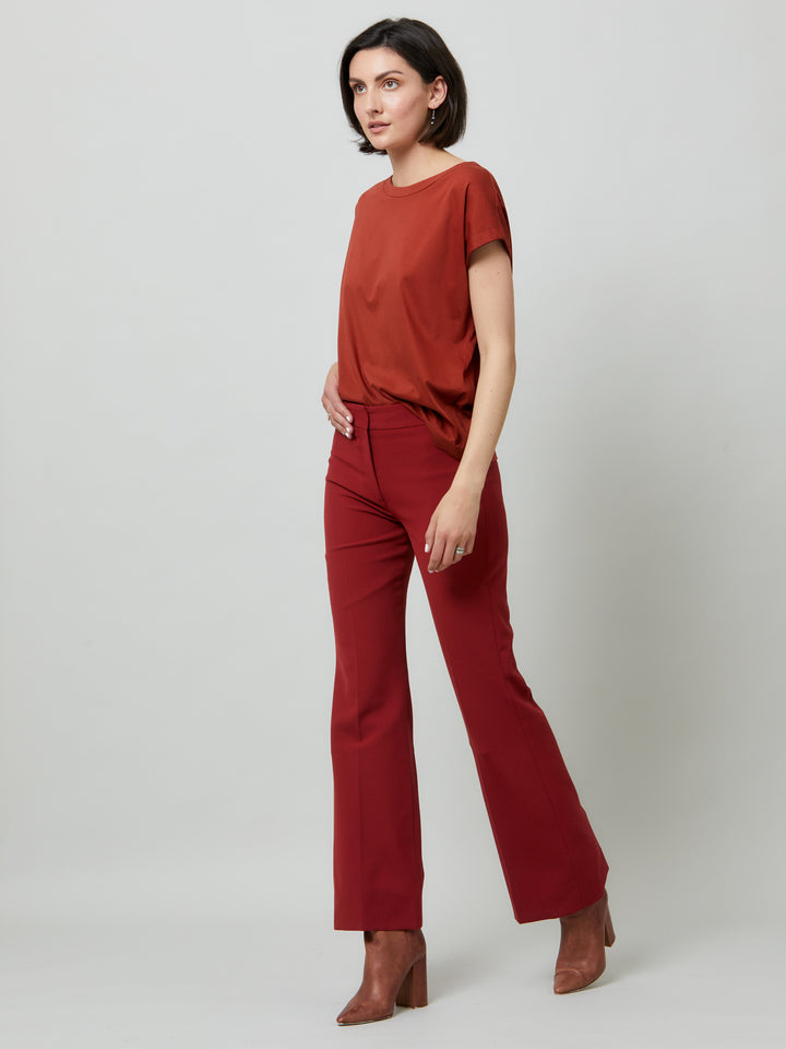 Kelly, a russet red flare pant. Crafted in sustainable double crepe with a hint of stretch. Revisit the 70's for this season’s game-changing look. Flares are sophisticated, comfortable & leg-lengthening. Guaranteed to flatter the form & never far from fashion’s front line.