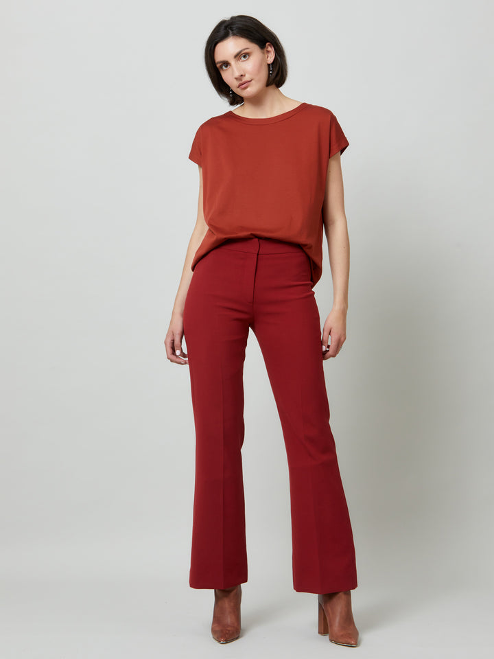 Kelly, a russet red flare pant. Crafted in sustainable double crepe with a hint of stretch. Revisit the 70's for this season’s game-changing look. Flares are sophisticated, comfortable & leg-lengthening. Guaranteed to flatter the form & never far from fashion’s front line.