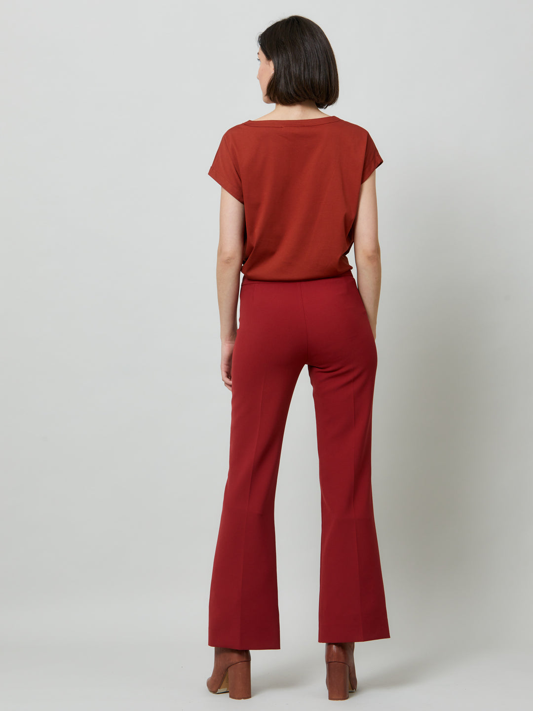 Kelly, a russet red flare pant. Crafted in sustainable double crepe with a hint of stretch. Revisit the 70's for this season’s game-changing look. Flares are sophisticated, comfortable & leg-lengthening. Guaranteed to flatter the form & never far from fashion’s front line.