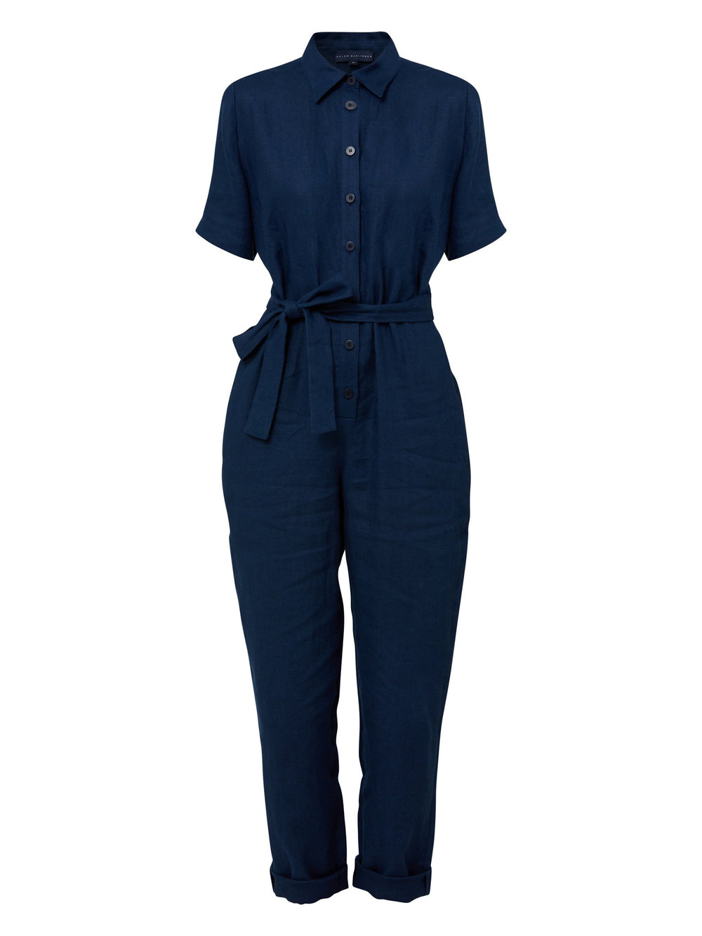 Peggy, a slim-leg jumpsuit in a classic indigo linen with a neat button-up collar, tie waist and short sleeves. Relaxed workwear or holiday lunches...this one-piece has you covered.